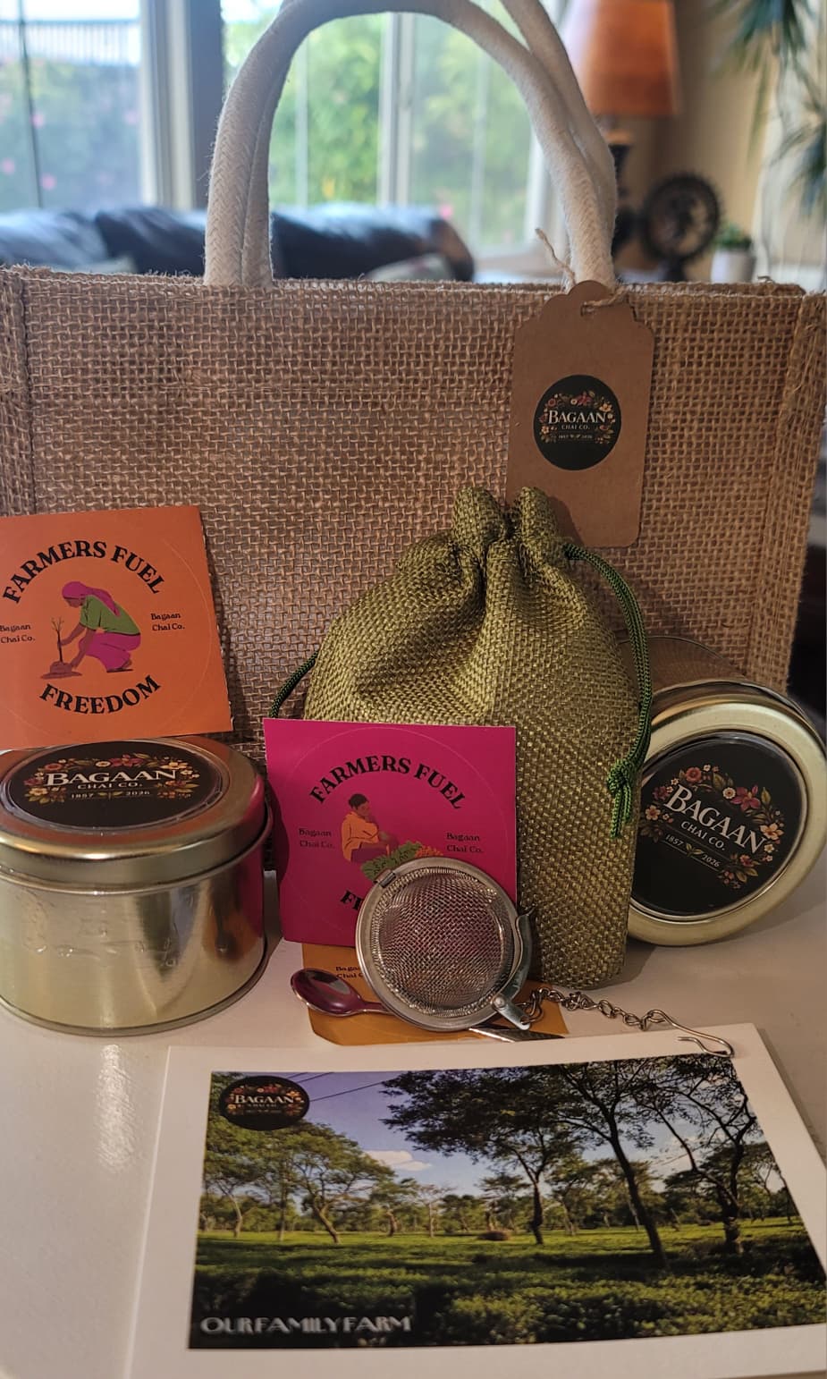 Regenerative Assam Tea Gift Combo with Assam tea tins, strainer, spice spoon, and reusable jute gift bag
